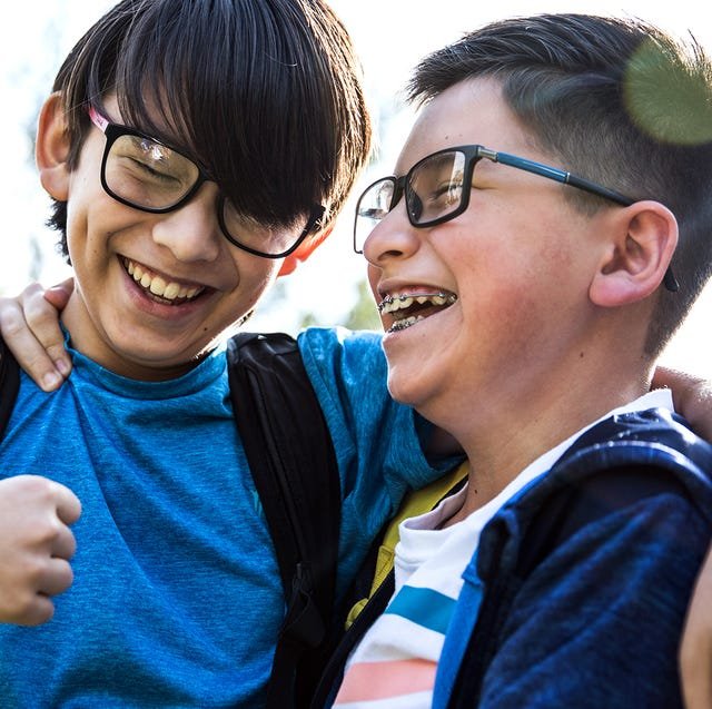 two tween boys laughing